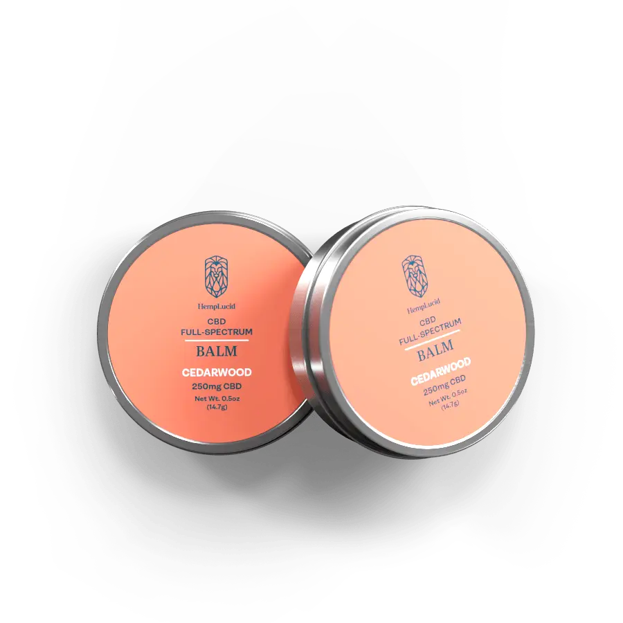 Two tins of HempLucid CBD Full-Spectrum Balm with Cedarwood, each containing 250mg CBD, displayed with salmon-colored labels.