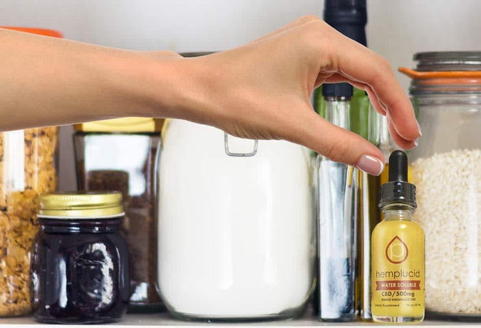hand reaching for hemplucid CBD in pantry